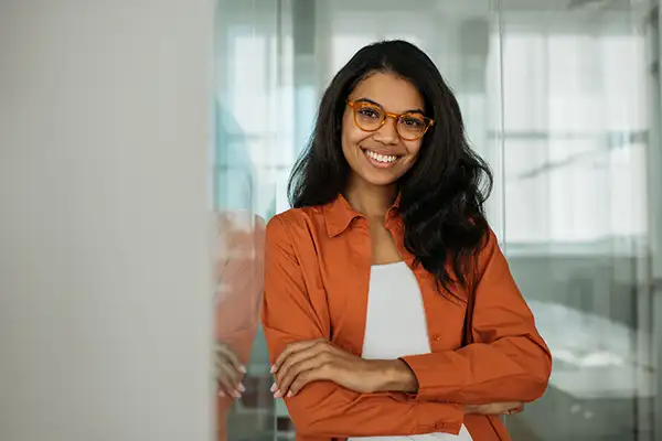 Smiling woman with arms crossed